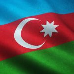 A closeup shot of the waving flag of Azerbaijan with interesting textures