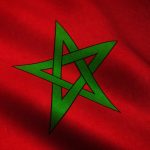 A closeup shot of the waving flag of Morocco with interesting textures