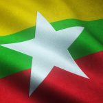 A closeup shot of the waving flag of Myanmar with interesting textures